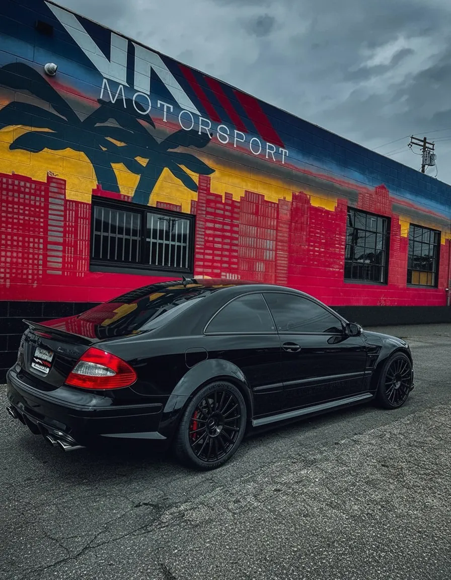 Black AMG coupe outside VA Motorsport shop mural in North Hollywood